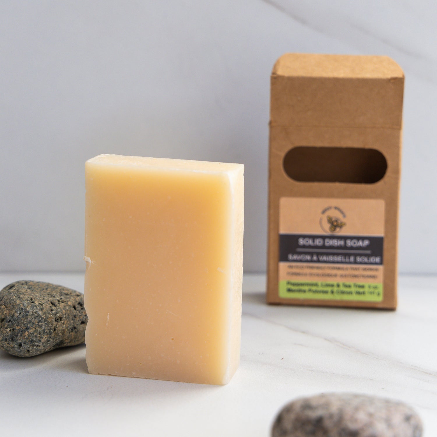 A solid bar of peppermint, lime & tea tree scented eco-friendly dish soap