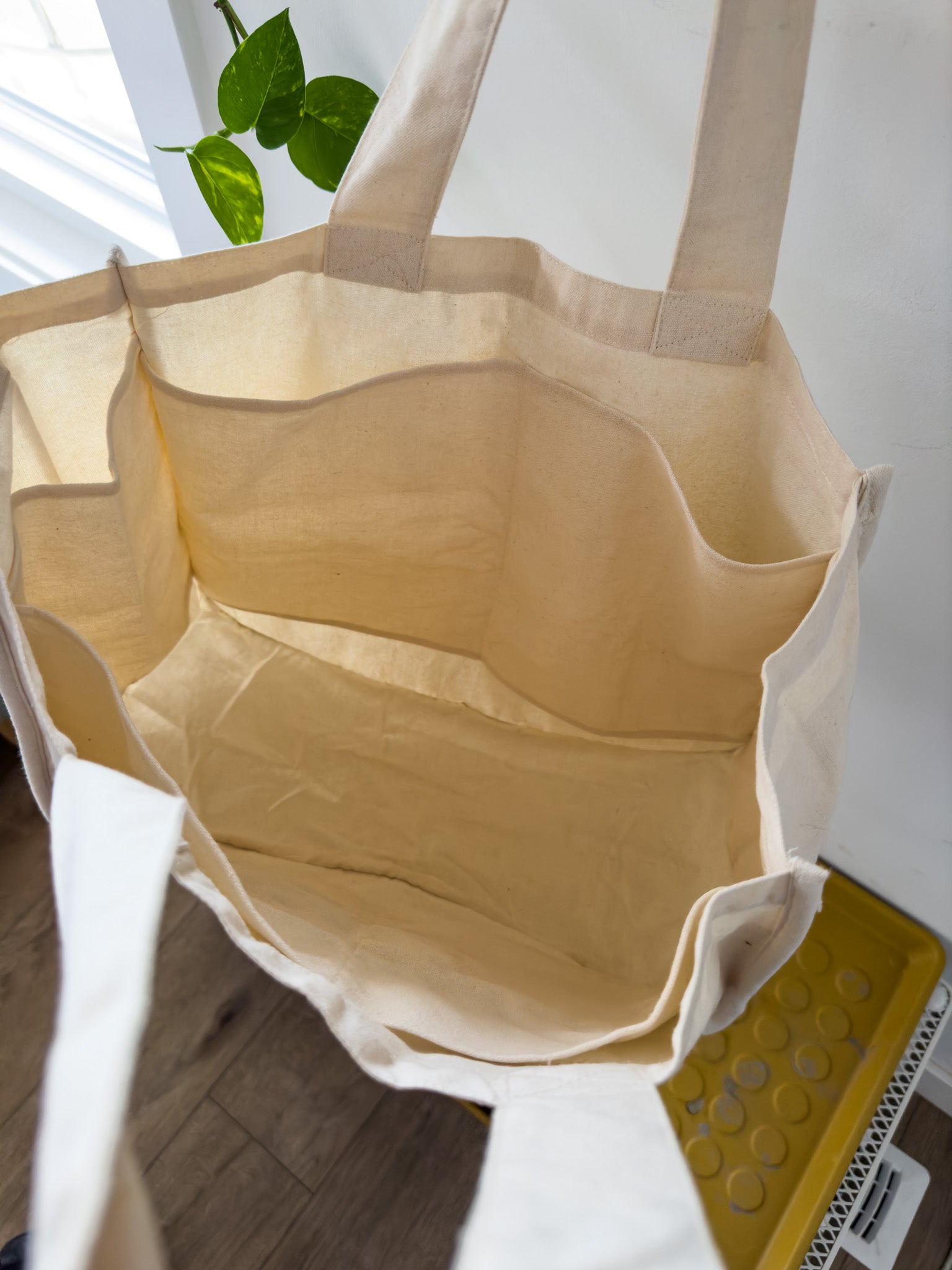 An interior shot of a Larch Life tote bag showing the internal pockets