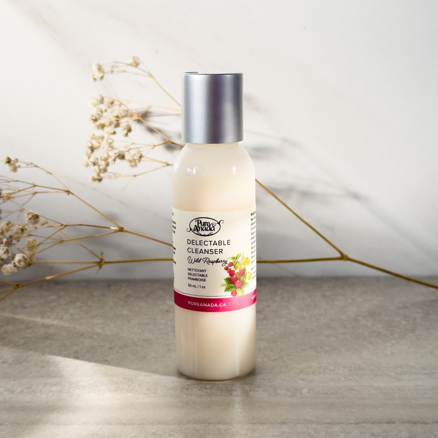 A bottle of raspberry scented natural Pure Anada face cleanser for sensitive skin