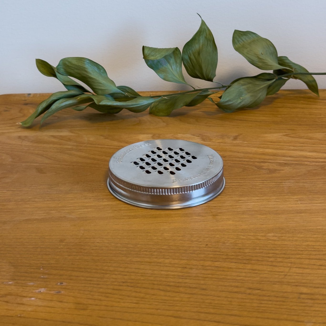 A stainless steel grater lid for wide-mouth mason jars
