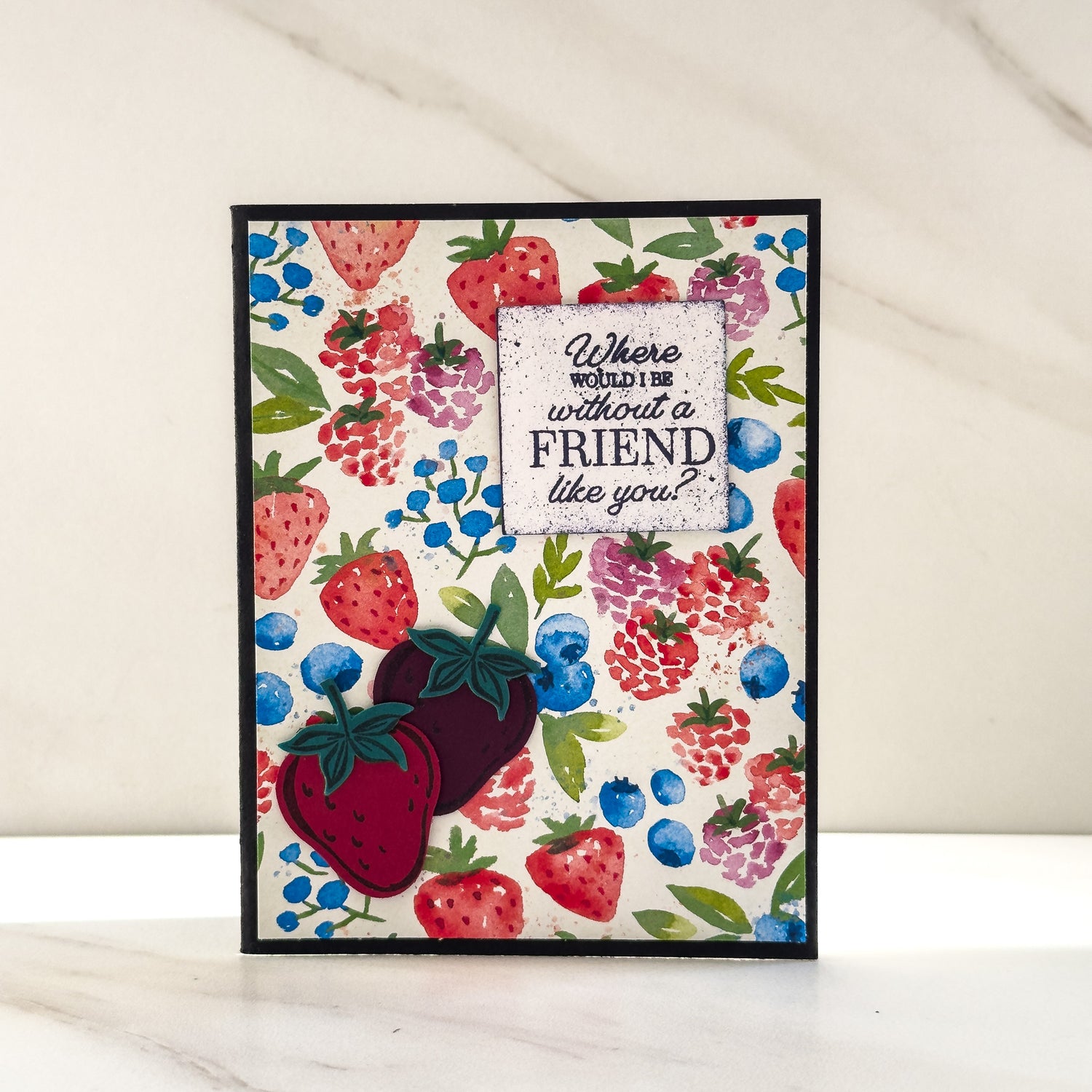 A handmade &quot;friendship&quot; card by Edmonton artist Cassandra Johnson with strawberry motif