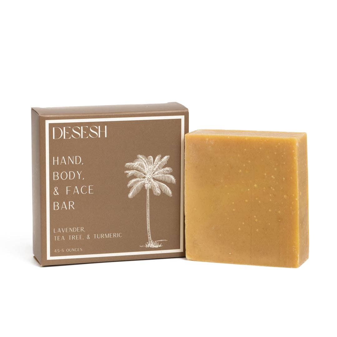 A bar of Desesh natural bar soap in lavender, tea tree, and turmeric variety