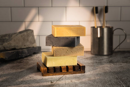 A stack of Desesh natural bar soaps, one of each variety