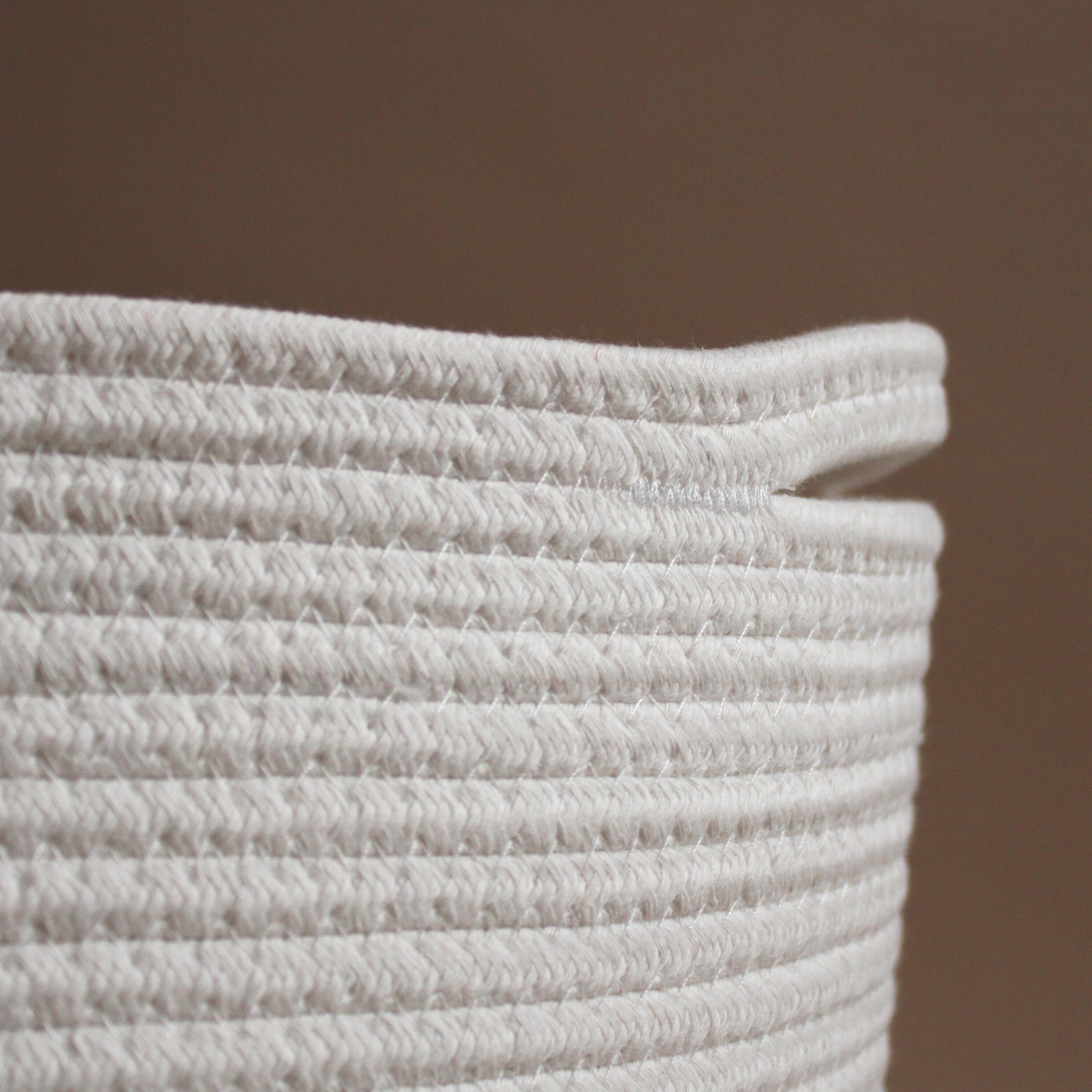 A close-up of a handmade natural cotton basket showing texture 