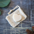 Eco-friendly hydrating conditioner bar on top of a sisal bag