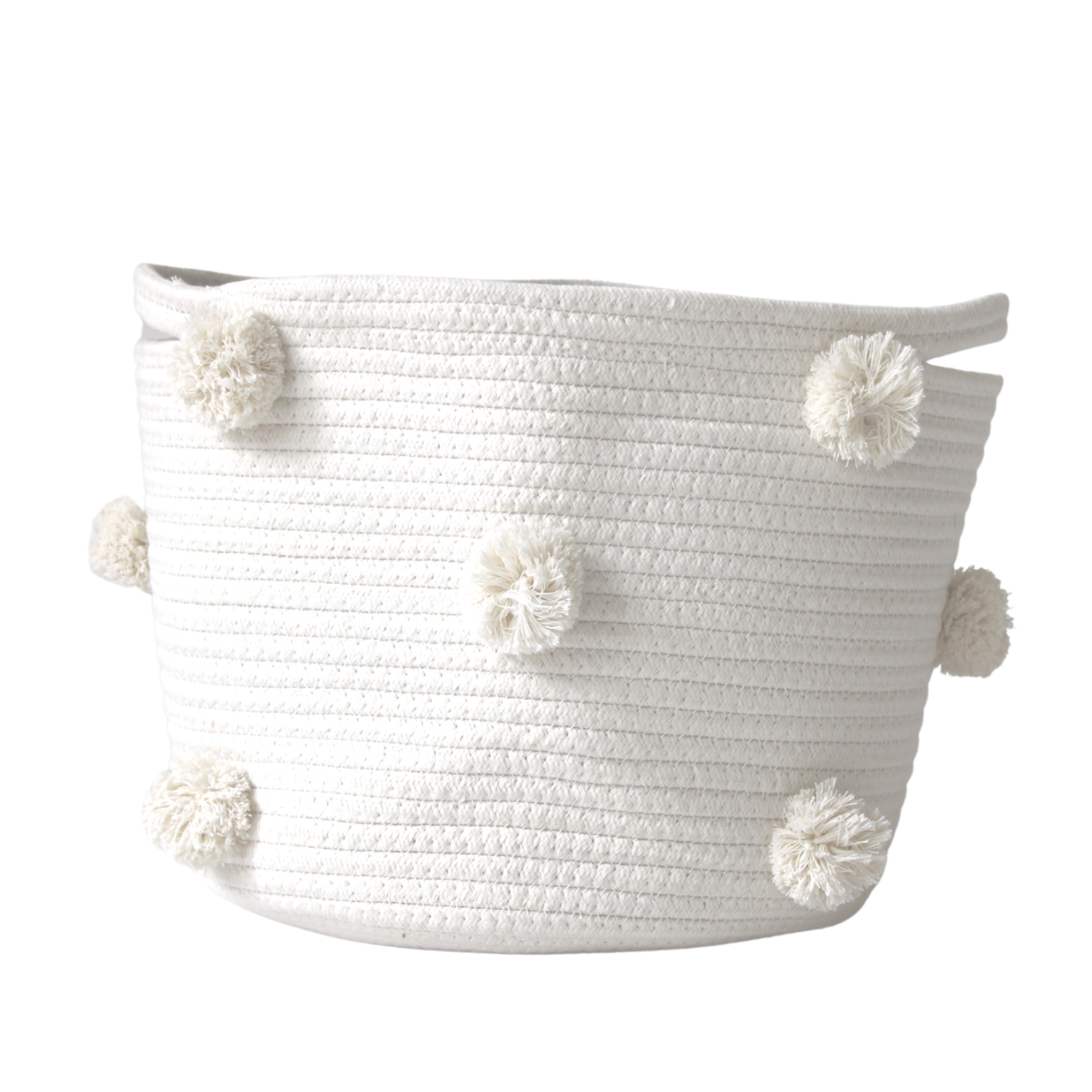 A medium handmade natural cotton basket with white pom-poms