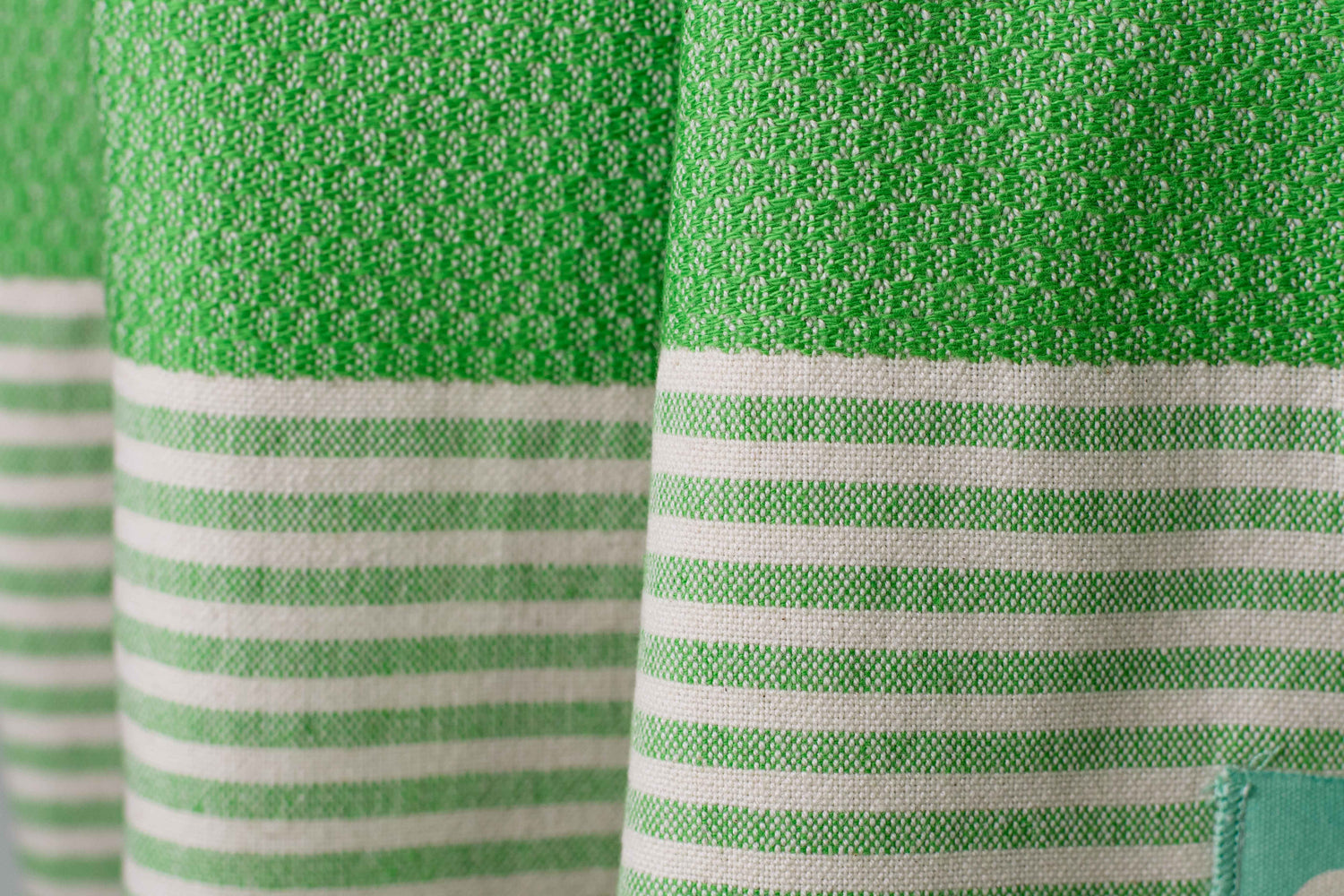 Texture of a grass green Turkish bath towel