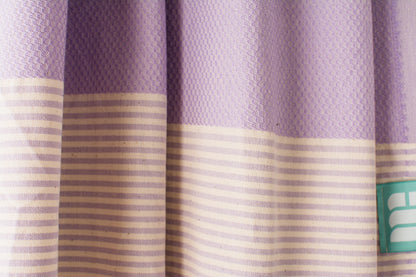 Texture of a lilac Turkish bath towel