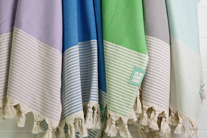 Five Turkish bath towels in a variety of colours