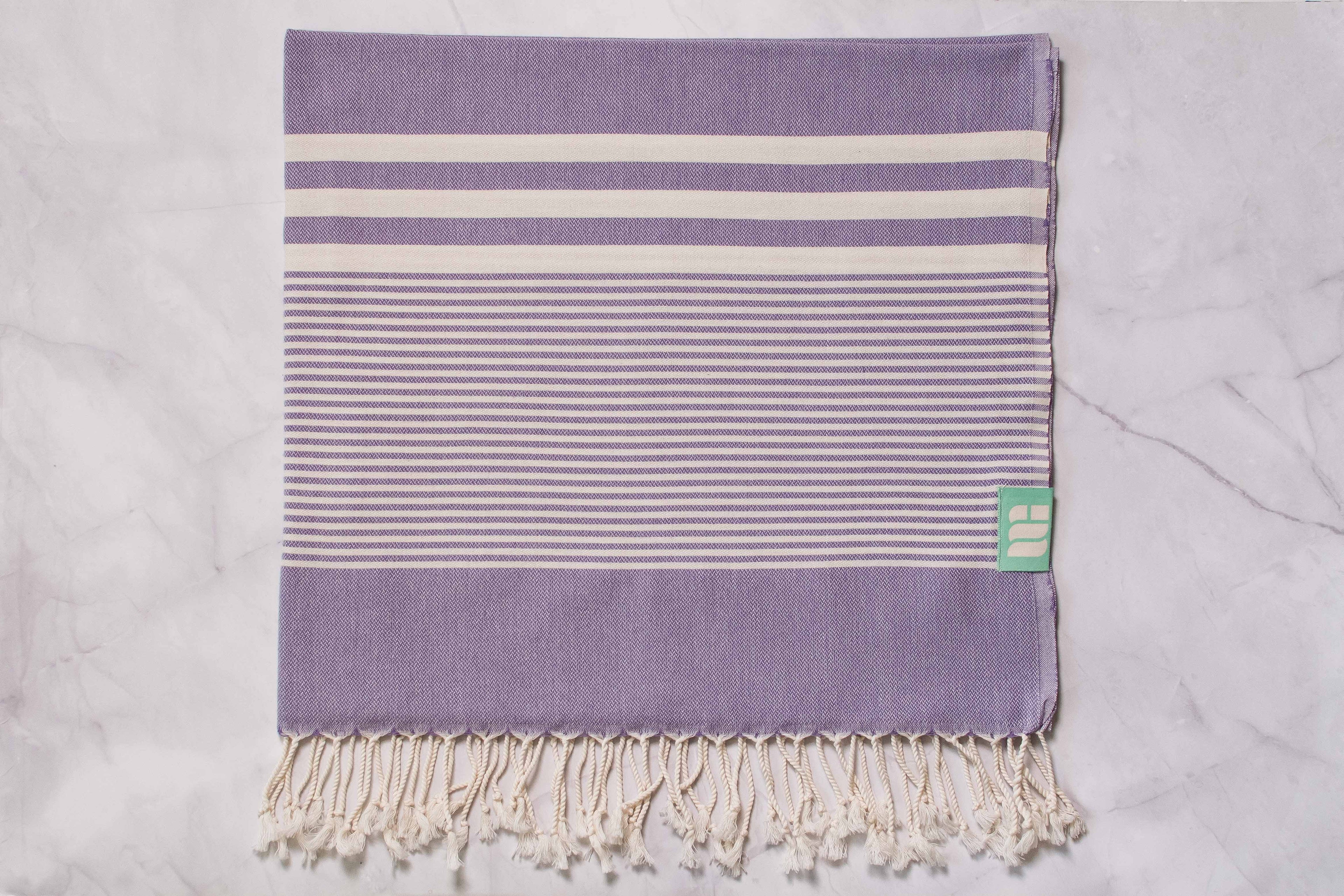 A purple lightweight Turkish bath towel