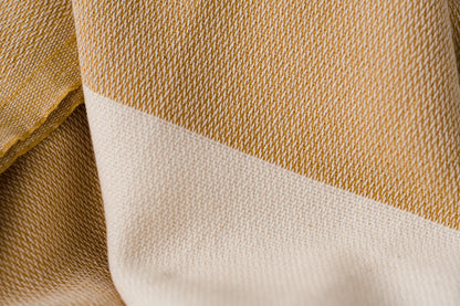 Texture of a mustard yellow Turkish bath towel