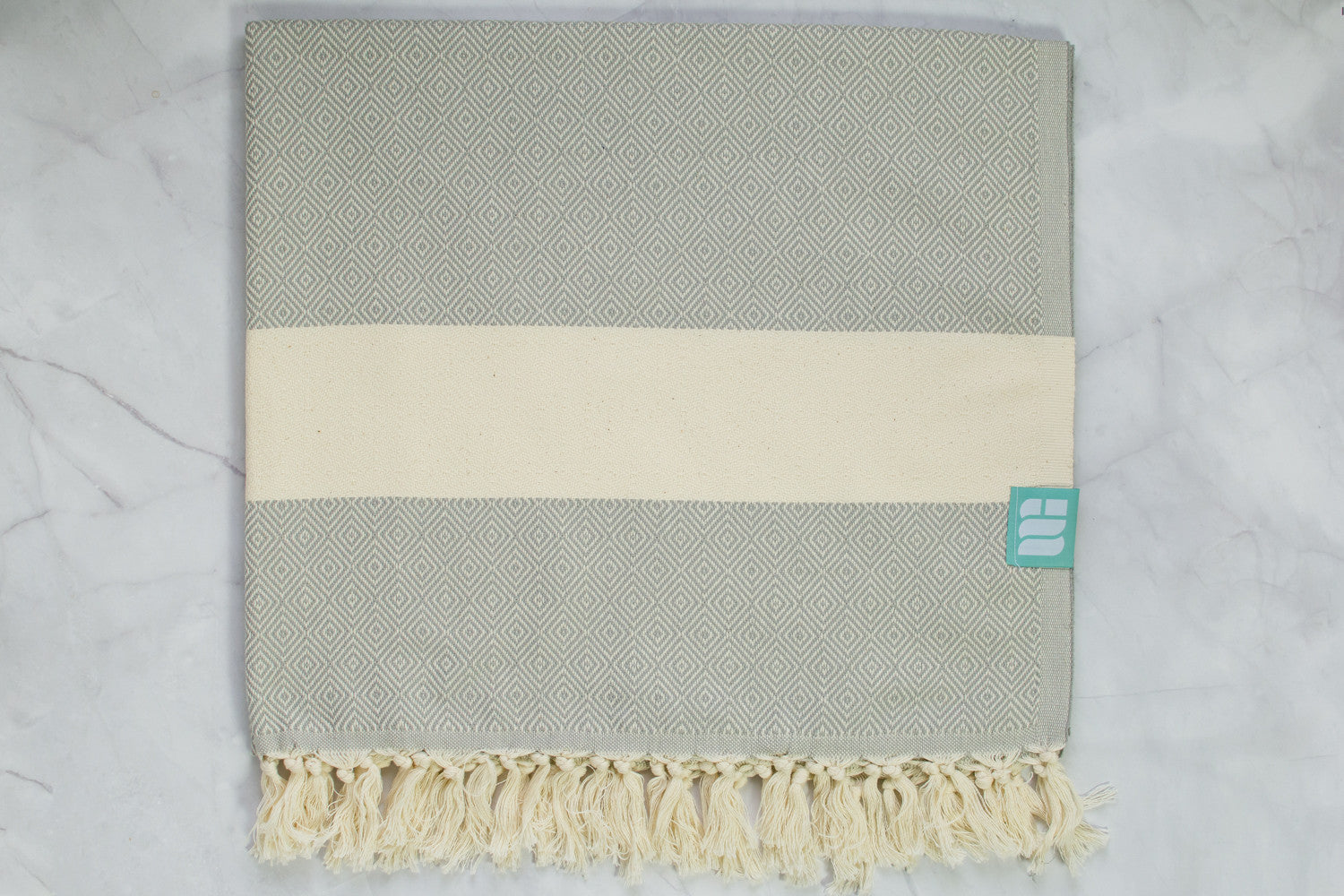 A light grey heavy weight geometric patterned Turkish bath towel