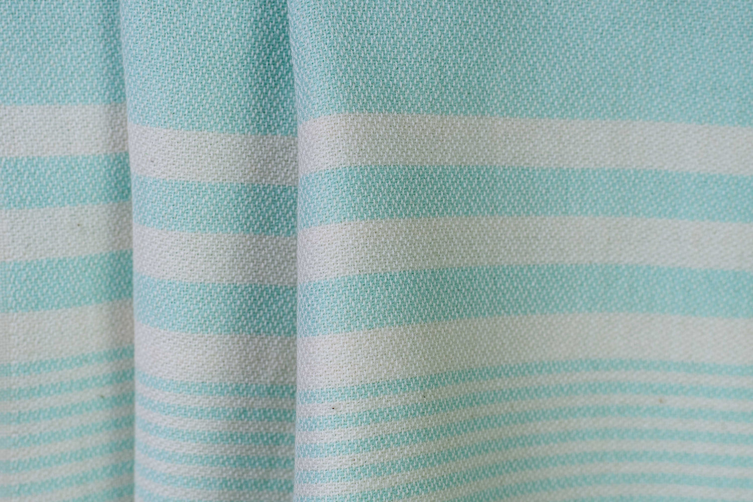 Texture of an aqua lightweight Turkish hand towel