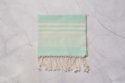 An aqua lightweight Turkish hand towel