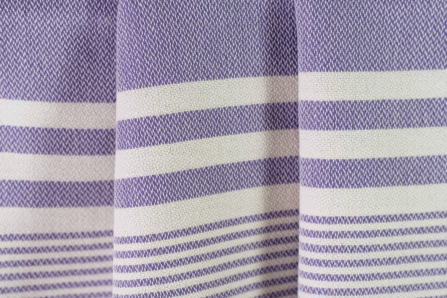 Texture of a purple lightweight Turkish hand towel