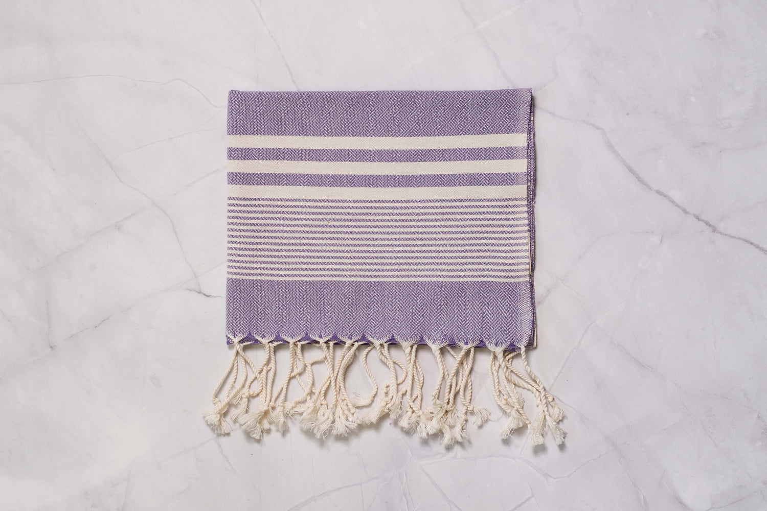 A purple lightweight Turkish hand towel