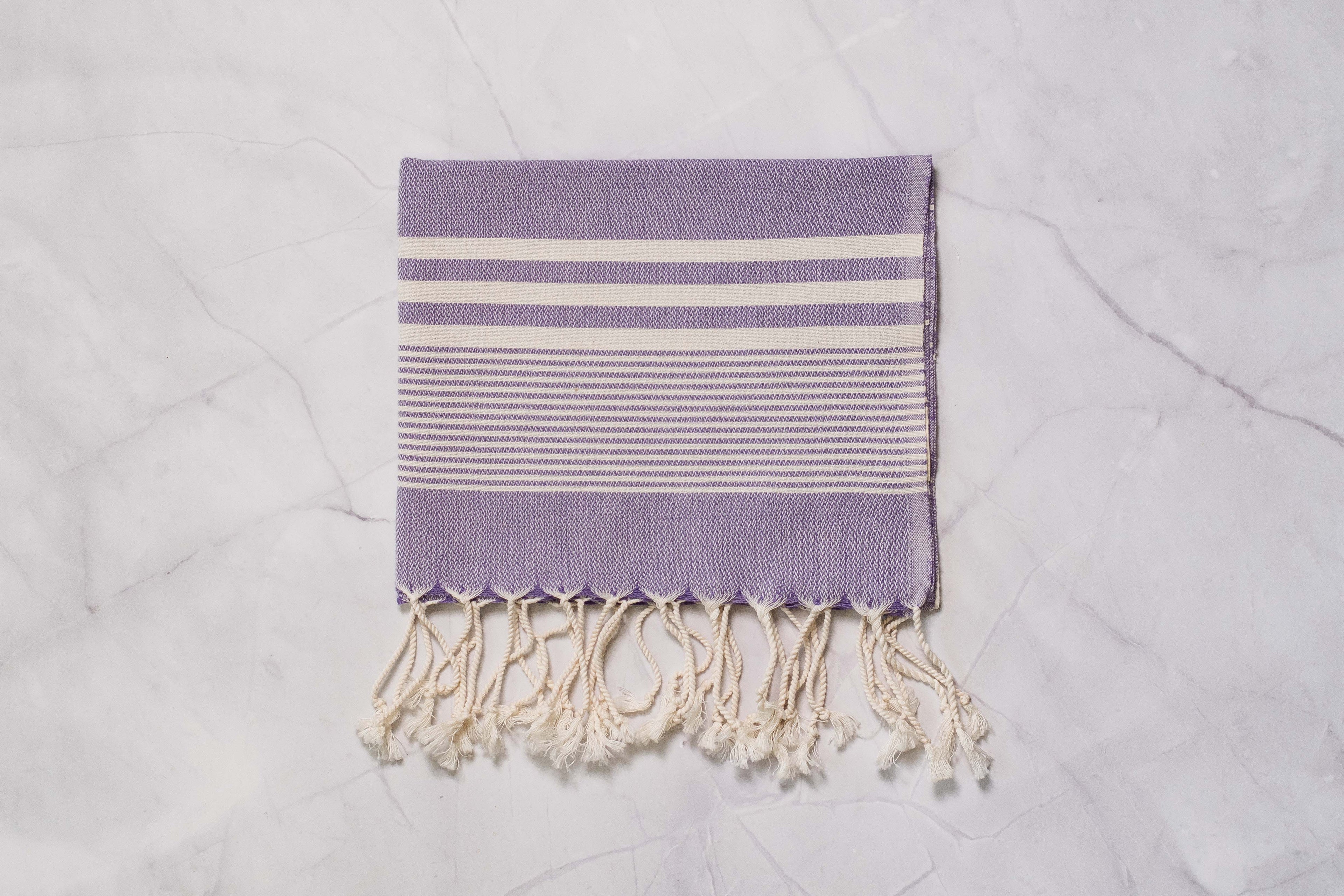 A purple lightweight Turkish hand towel