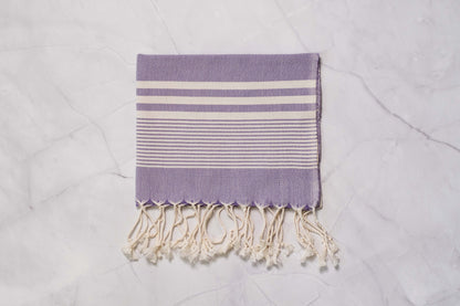 A purple lightweight Turkish hand towel