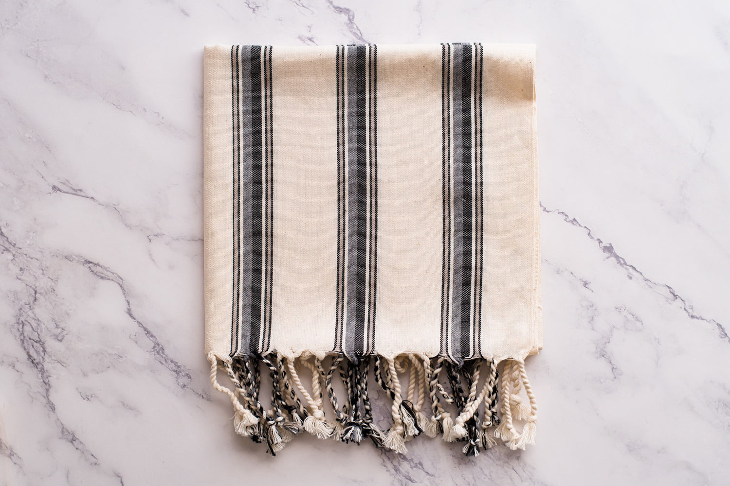 A white and grey natural cotton Turkish hand towel