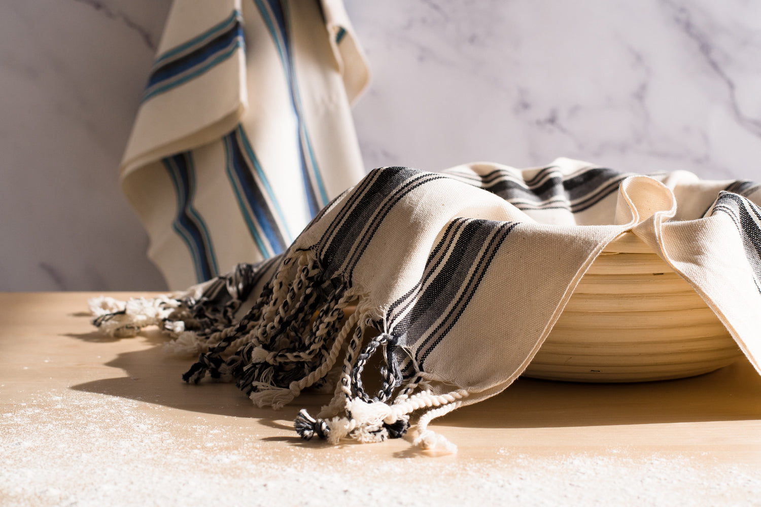 A variety of natural cotton Turkish hand towels being used in a kitchen