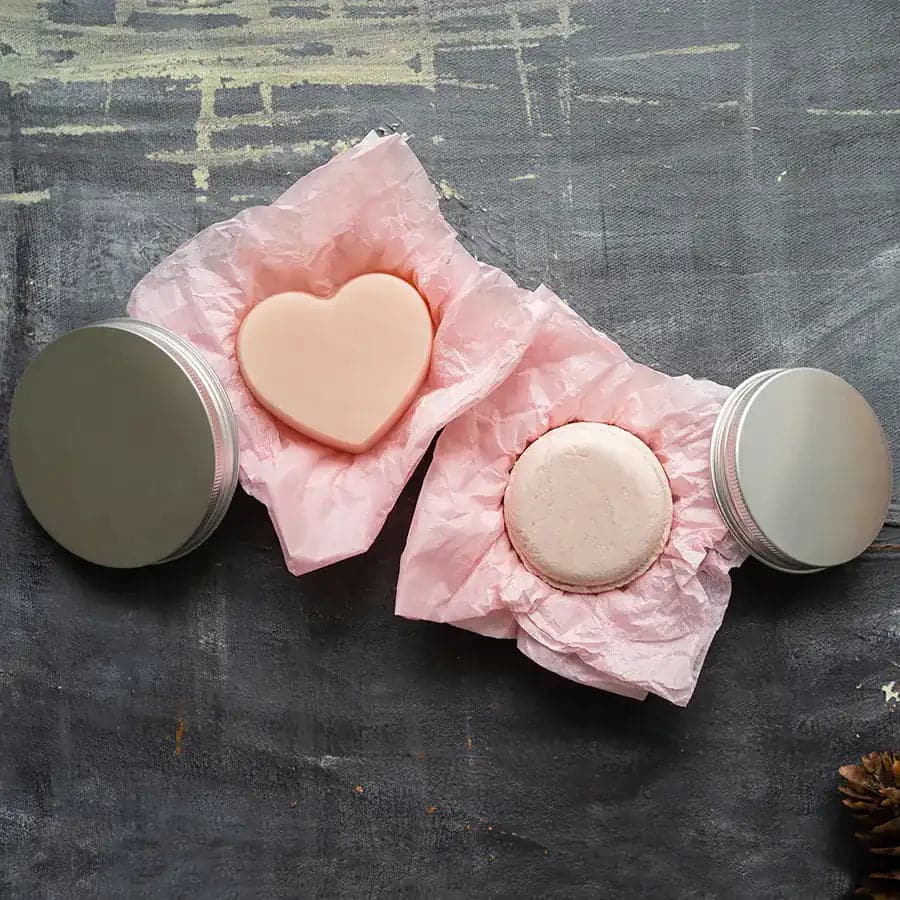 Eco-friendly nourishing shampoo and conditioner bar set in tins