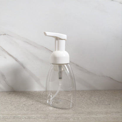 A reusable foaming hand soap dispenser