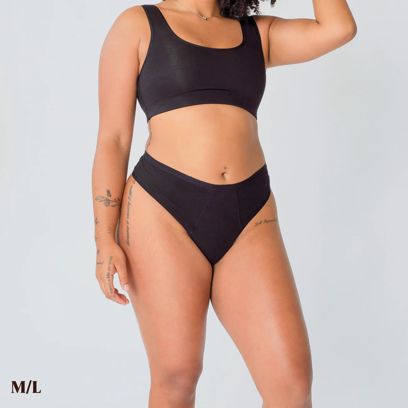 A person wears size M/L REVOL thong underwear