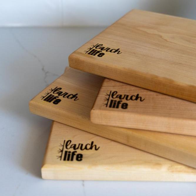 A close-up of the logo on solid hard maple cutting boards