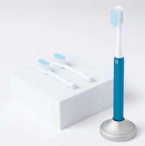 A sustainable Nada kid-size toothbrush with blue anodized handle