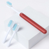 A sustainable Nada kid-size toothbrush with red anodized handle