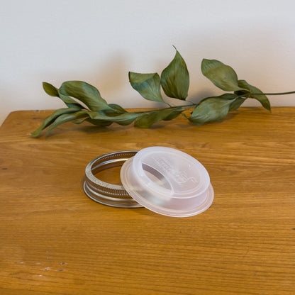 A sustainable silicone travel lid for a wide-mouth mason jar